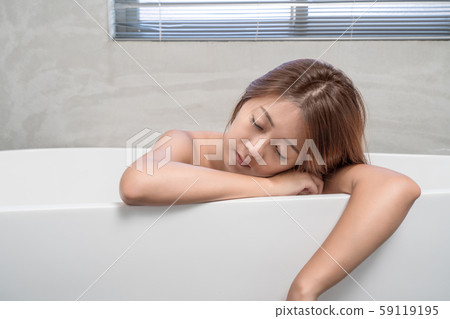 Young and beautiful girl using phone relaxing in 59119195