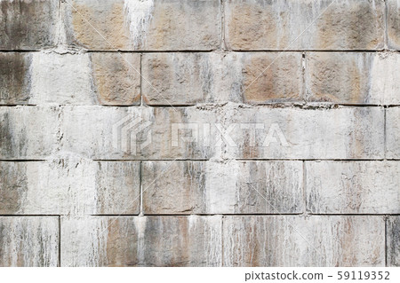 Eflorescence that exudes from the joints of the concrete block of the retaining wall Eflorescence that exudes from the joints of the concrete block of the retaining wall 59119352