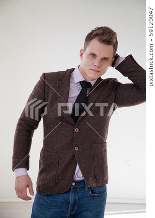portrait of a handsome fashionable man in a business suit in the office portrait of a handsome fashionable man in a business suit in the office 59120047