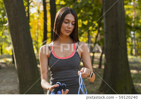 Pretty lady taking her stuff home after workout 59120240