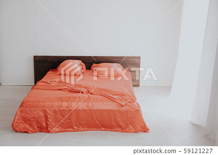 the Interior of the white room with a bed with red 59121227