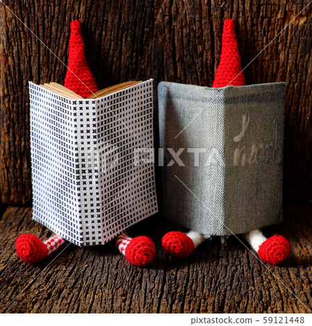 Busy concept with face hidden by book, looking for information 59121448