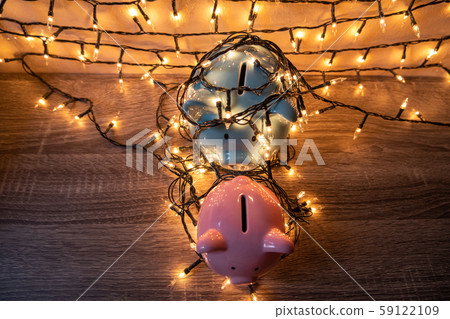 Pink and blue piggy bank with glittering lights, organize parties for successful activities to save money for retirement Pink and blue piggy bank with glittering lights, organize parties for successful activities to save money for retirement 59122109