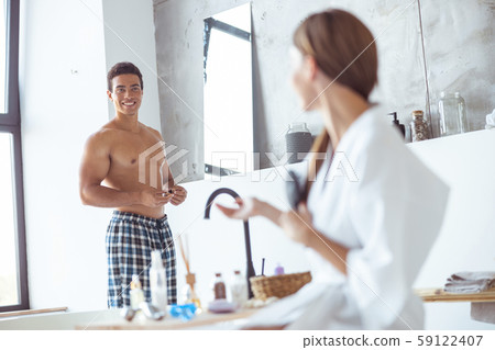 Positive delighted man is demonstrating his smile Positive delighted man is demonstrating his smile 59122407