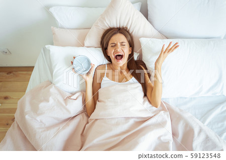 Emotional girl keeping eyes closed while crying Emotional girl keeping eyes closed while crying 59123548