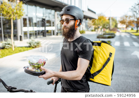 Courier delivering takeaway food Courier delivering takeaway food 59124956