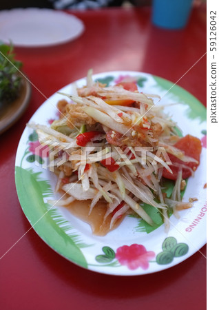 Papaya Salad (Som tum Thai) on Red table Papaya Salad (Som tum Thai) on Red table 59126042