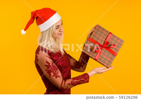 A beautiful sexy girl in a New Year's hat and gray 59126206