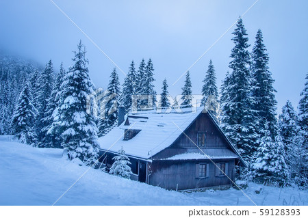 Wooden house in winter mountains. Village house on 59128393