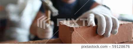 Professional bricklayer working on construction 59128676