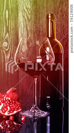 bottle and wineglass with pomegranate wine bottle and wineglass with pomegranate wine 59129006