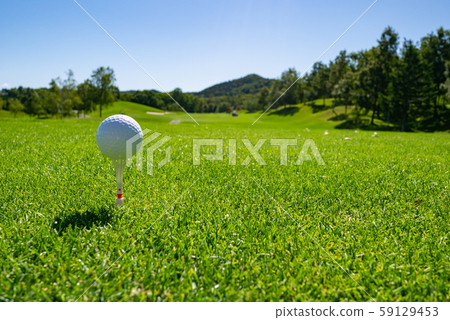 Summer scenery of a golf course teeing ground and a birch forest. Summer scenery of a golf course teeing ground and a birch forest. 59129453