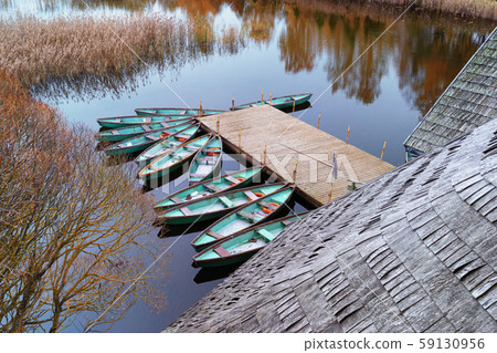 Fishing boats at the pier on the lake in autumn 59130956