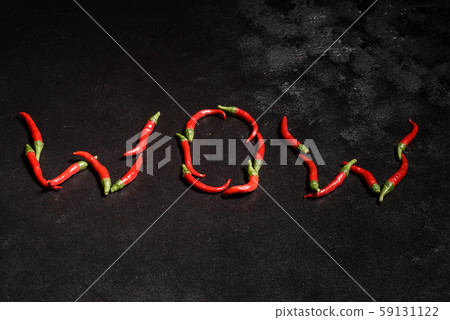Bright red chilli pepper on a grey concrete background 59131122