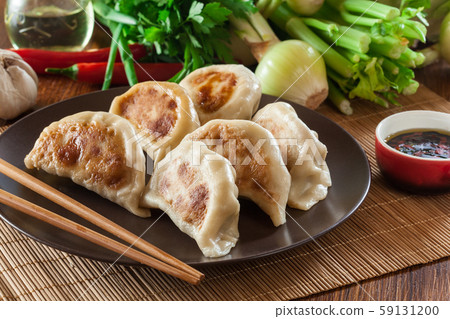 Japanese dumplings - Gyoza with pork meat and Japanese dumplings - Gyoza with pork meat and 59131200