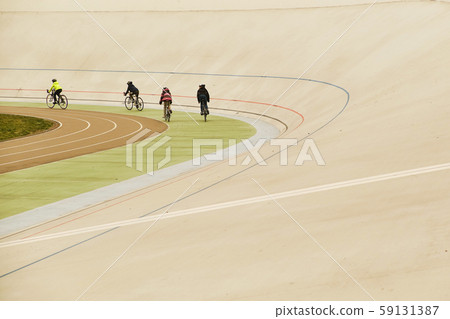 Cyclists ride the track in the stadium 59131387
