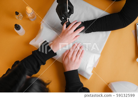 Cuticle movement with an orange stick. 59132599