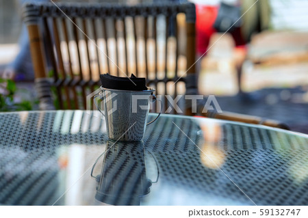Bucket with napkins on a cafe table 59132747