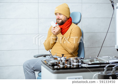 Sick patient with runny nose at the medical office Sick patient with runny nose at the medical office 59133450