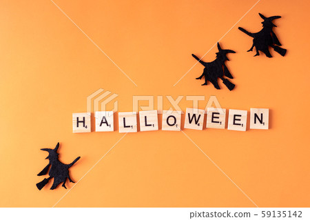 Halloween holiday minimal top view image of letter with text and whitch. Holiday background Halloween holiday minimal top view image of letter with text and whitch. Holiday background 59135142