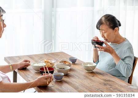 Elderly couple dining table miso soup 59135834