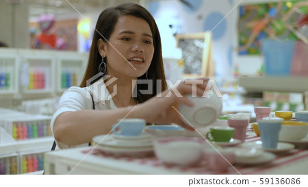 Shopping concepts. The girl is buying the Shopping concepts. The girl is buying the 59136086