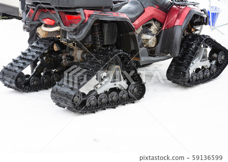 Closeup of snowmobile with snow at ski resort. 59136599