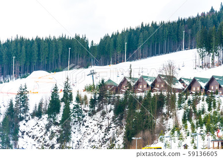 Beautiful view of winter resort with hotels and 59136605