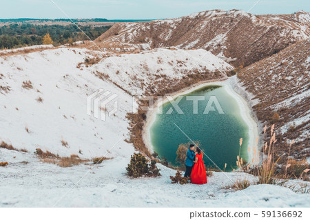 Beautiful couple walking in the phosphate-gypsum Beautiful couple walking in the phosphate-gypsum 59136692