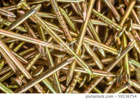 Texture of yellow nails on red background. Texture of yellow nails on red background. 59136754