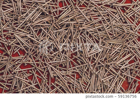 Texture of yellow nails on red background. Texture of yellow nails on red background. 59136756