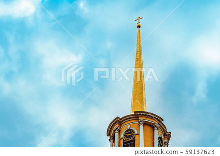 a tall old tower with a spire at the top 59137623
