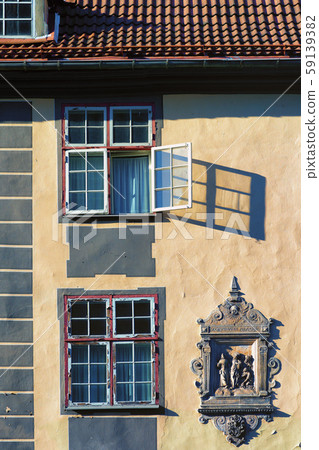 Open window on the facade of an old house Open window on the facade of an old house 59139382