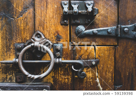 Wooden door with antique locks 59139398