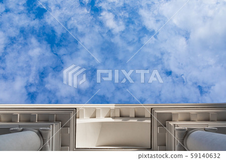 Bottom view of sky and white building Bottom view of sky and white building 59140632