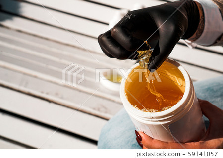 Natural honey sugar paste shugaring closeup Natural honey sugar paste shugaring closeup 59141057