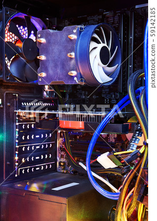 Heatsink with the CPU cooler fan inside pc system unit. 59142185