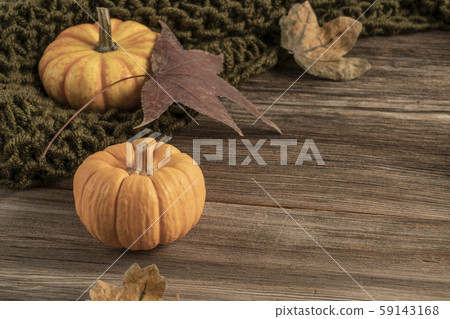 wooden table decorated with pumpkins and dried 59143168