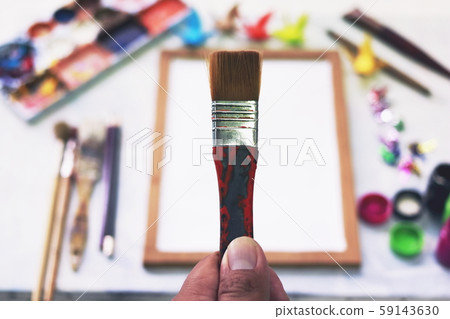 Top view. Brush handle above the palette.Hobbies,free time,Lifestyle,they are for art and Drawing. 59143630