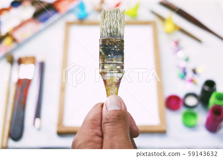 Top view. Brush handle above the palette.Hobbies,free time,Lifestyle,they are for art and Drawing. 59143632