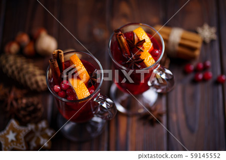 Hot spiced mulled wine with cranberry and orange 59145552
