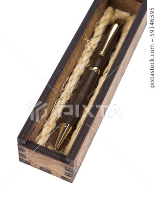Beautiful wooden box with ballpoint pen inside on Beautiful wooden box with ballpoint pen inside on 59146395