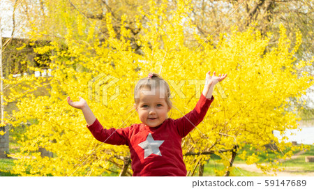 Cute little girl with star on clothes looking in camera Cute little girl with star on clothes looking in camera 59147689