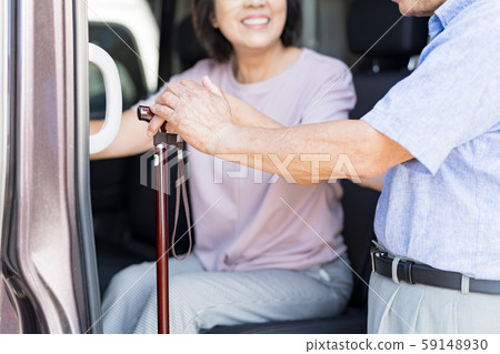 Senior couple (car, walking stick, walking stick, nursing care 59148930