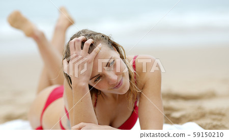 Young and sexy woman at the beach 59150210