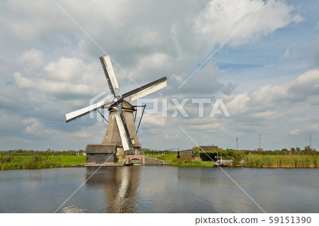 Windmill beside a canal 59151390