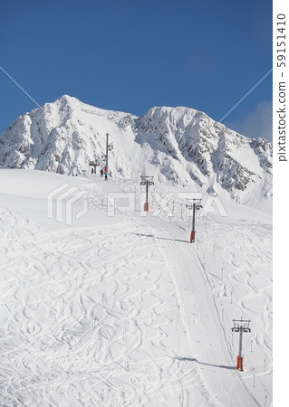 Skiing slopes sunny weather 59151410