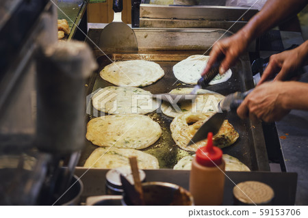 Taiwan street food pancake Cooking on hot plate Asian food travel Taiwan street food pancake Cooking on hot plate Asian food travel 59153706