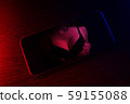 cell phone on dark background 59155088