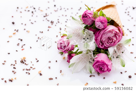 Bouquet of flowers in a waffle cone on a chocolate pattern Bouquet of flowers in a waffle cone on a chocolate pattern 59156082
